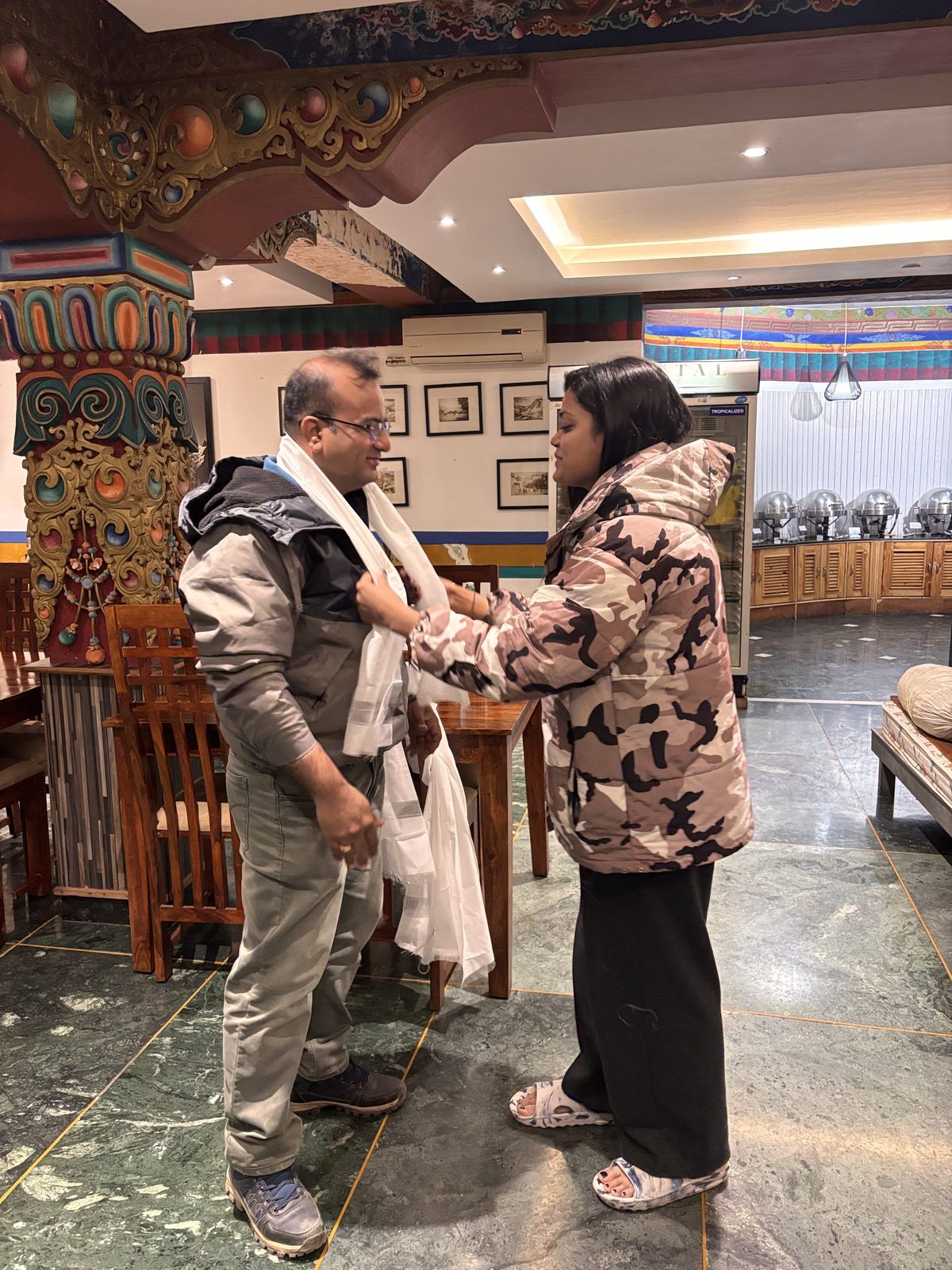Sandeep Jain receiving a ceremonial khata scarf during a Himalayan road trip