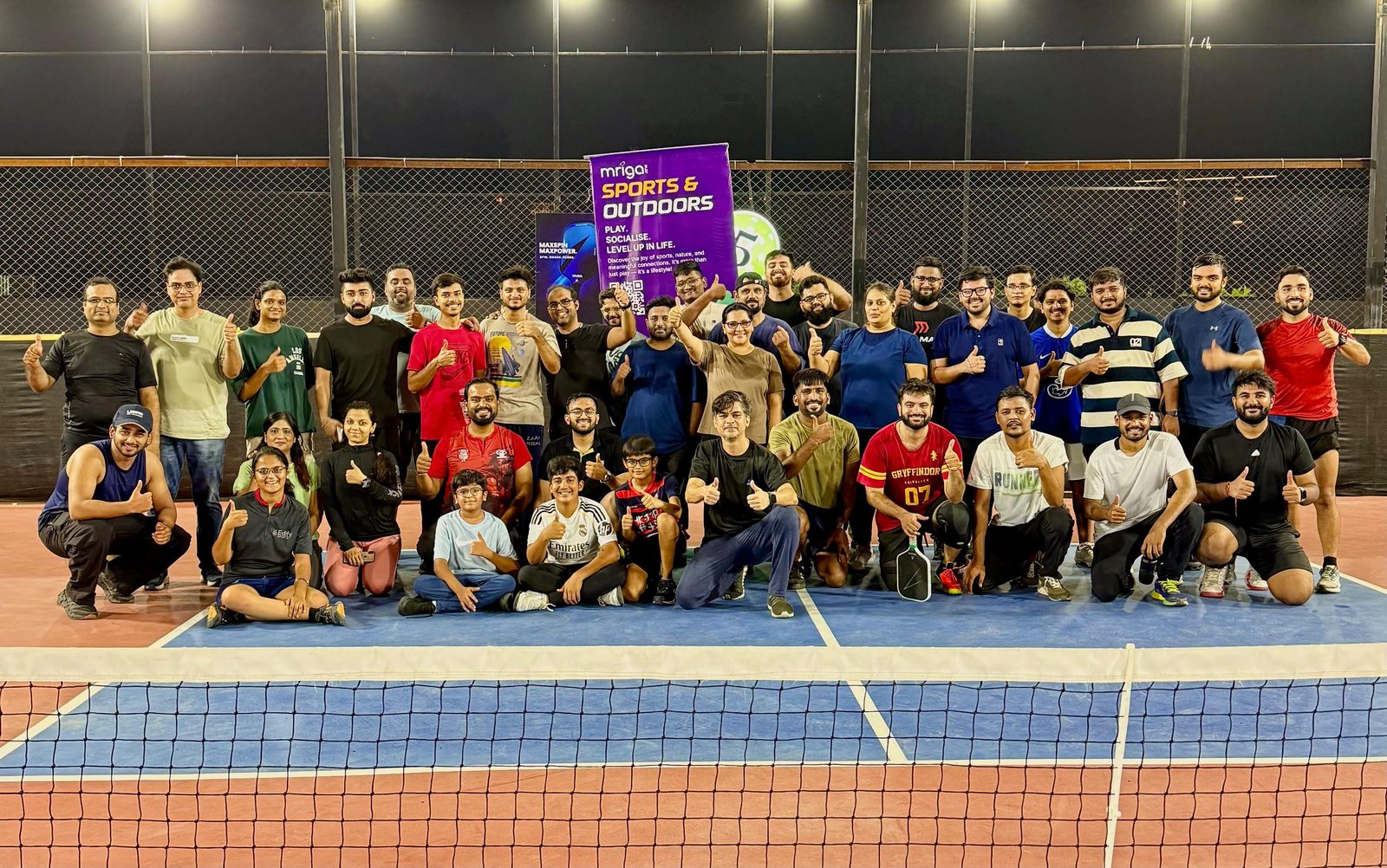 Sandeep Jain with a group at a community pickleball event